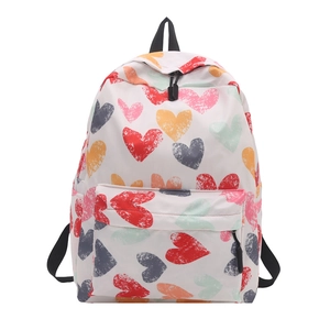 Sac à dos blanc minimaliste avec imprimés graffitis de cœurs colorés et zips noirs