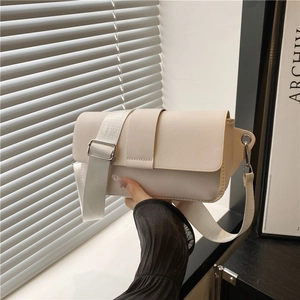 Minimalist cream rectangular shoulder bag with adjustable nylon strap and metal buckle