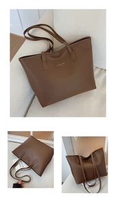 Detalle del bolso tote marrón oscuro con texto dorado de Nueva York y textura de cuero PU