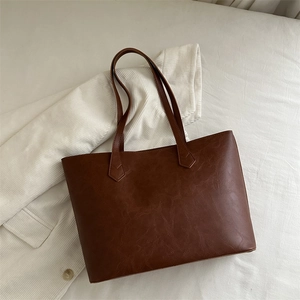 Retro coffee brown tote bag with pleated texture and long shoulder straps for daily commute