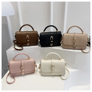 Front view of five leather satchel bags in various colors with gold horseshoe buckles