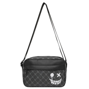 Fashionable dark gray messenger bag with graffiti smiley face and wide adjustable strap