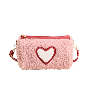 Pink fleece cylinder crossbody bag with heart embroidery and red leather strap