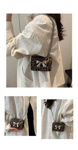 Detail of mini leopard print bag with silver bow ornament and chain strap
