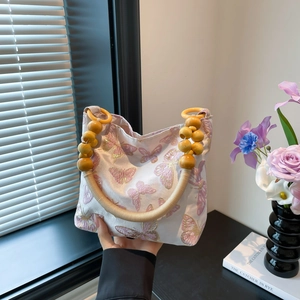 Vintage Chinese style handbag with butterfly embroidery and yellow beaded strap