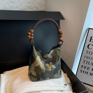 Vintage style tote bag with golden butterfly jacquard and wooden bead handles