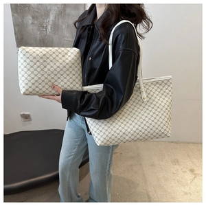 Detail of large tote and matching pouch with classic geometric patterns for women