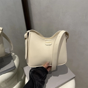 Sac seau minimaliste beige avec logo FASHION et bandoulière réglable