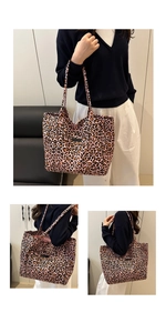 Detail of pink leopard print tote bag with black rectangular label and canvas texture