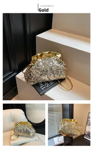 Close-up of elegant gold sequin evening clutch with ruffled edges and sleek metallic strap