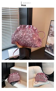 Detailed shot of pink sequin shoulder bag with pleated metallic trim and thin strap