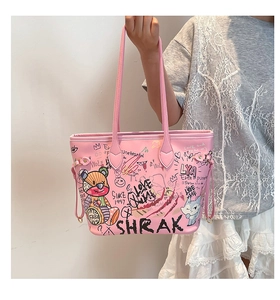 Detailed view of pink graffiti tote bag featuring street art graphics and bear cartoon