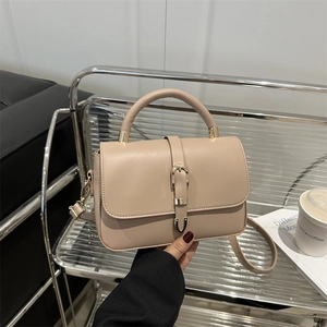 Retro beige leather crossbody bag with top handle and gold clasp for casual women's style