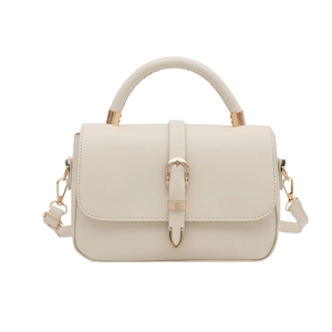 Cream white faux leather shoulder bag with gold hardware and horseshoe buckle design