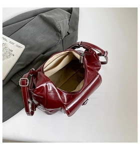 Top view of the deep red polished tote bag showing spacious interior and secure zipper pocket