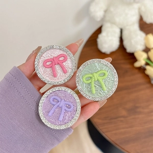 Bowknot phone grip with rhinestones in macaron colors pink, purple, and green