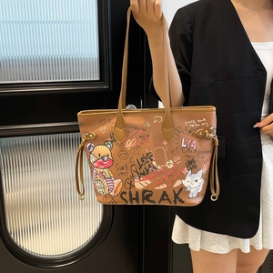 Brown leather tote bag with cute cartoon bear graffiti and dual shoulder straps