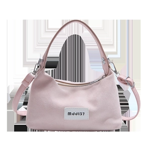 Pink matte leather dumpling handbag with MJJ137 label and adjustable shoulder strap