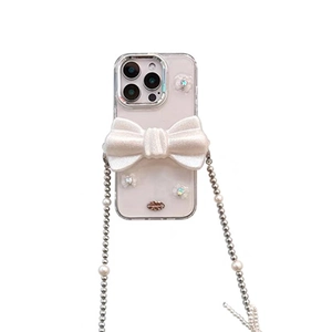 Coque iPhone 16 Pro avec nœud 3D pailleté et bandoulière élégante en perles