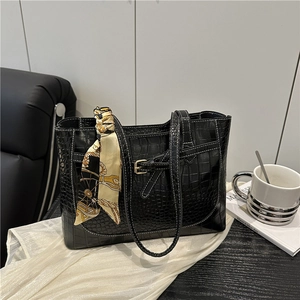 Black crocodile pattern tote bag with decorative silk scarf and white contrast stitching
