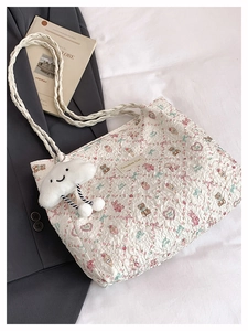Detailed quilted tote bag with cute animal prints and soft plush cloud pendant