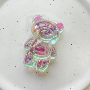 Detail of laser bear phone grip with aurora resin finish on a ceramic plate background