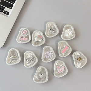 Set of silver floral and butterfly pop sockets for phone grip and desktop stand support