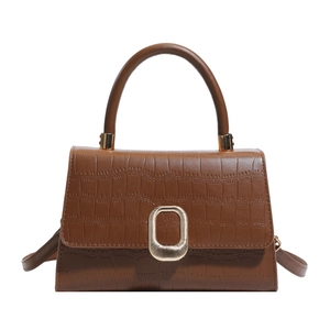 Brown crocodile embossed faux leather trapezoid handbag with gold metal clasp and top handle