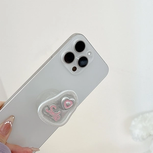 Detail of silver wavy phone socket with pink 3D heart and Smile text on phone back