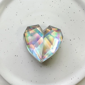 Detail of laser iridescent heart crystal socket with multi-faceted diamond cut texture