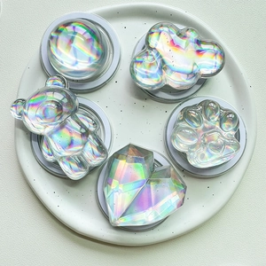 Detail of magnetic holographic phone grips in heart, bear, and cat claw shapes