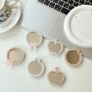 Luxe pearl and rhinestone mirror phone grip holders with crown and bowknot designs