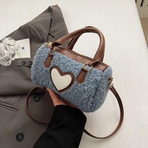 Furry pillow bag in blue teddy fleece and brown leather with white heart patch