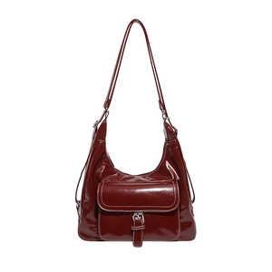 Vintage burgundy patent leather shoulder bag with white contrast stitching and buckle detail