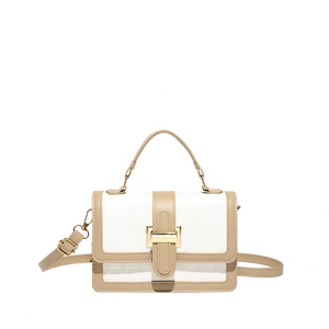 Elegant two-tone quilted leather handbag with geometric patterns and gold metal buckle