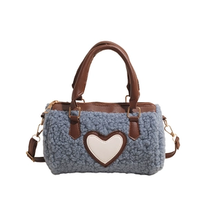 Chic blue fleece cylinder handbag with white heart patch and brown leather straps