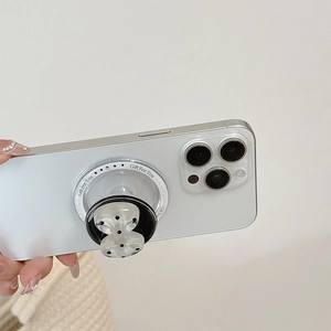 Close-up of pearl white bow resin phone socket with Gift For You print on a white phone