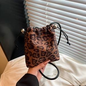 Handheld leopard print nylon mini bucket bag with drawstring closure and slim shoulder strap