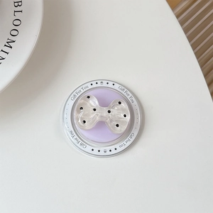 Detail of white bow magnetic phone grip with black dots and Gift For You packaging