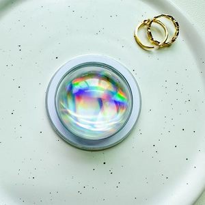 Close-up of a holographic 3D crystal ball phone socket with aurora iridescent effect
