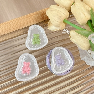 3D matte bear magnetic phone grip stand in pink green and purple on glass tray