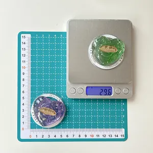 Detail shot of heart phone grip on scale showing 29.6g weight and size measurements