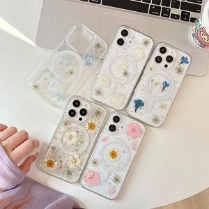 Floral MagSafe case for iPhone with real dried flowers and glitter on a desk