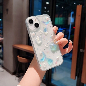 Close-up of iPhone clear case with 3D mermaid tails, pearls and glitter sequins