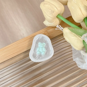 Detail of magnetic phone socket with pearl texture finish and a cute light blue 3D bear