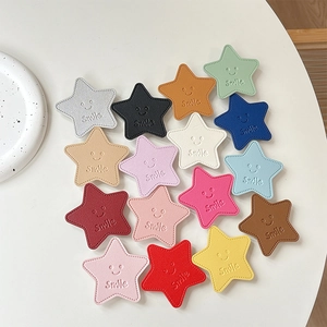 Star-shaped faux leather phone socket grip with smile face in multiple bright colors