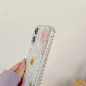 Detail showing side view of clear MagSafe case with pink flowers and silver glitter