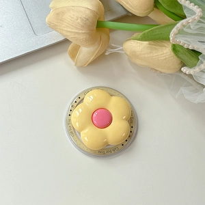 Detail of yellow flower MagSafe phone grip with Gift For You print on clear base