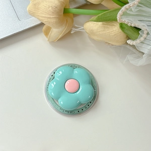 Macro detail of a light blue flower phone socket with Gift For You acrylic base