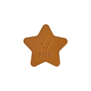 Brown leather star-shaped phone socket stand with smile emboss and lychee grain texture